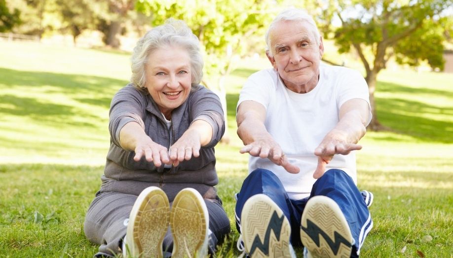 Seniors in the park stretching